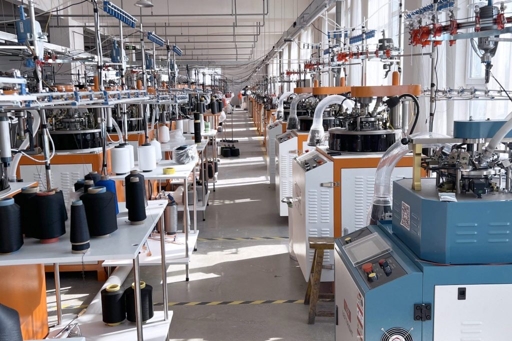 Knee support production line with knitting machines and factory equipment